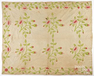 Trapunto quilt with floral design