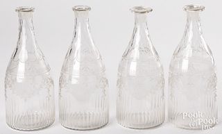 Set of four etched glass decanters, 19th c.
