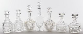 Three pairs of cut glass decanters, together with