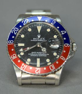 Early 1960's Rolex "Pepsi" Oyster Perpetual GMT Master Superlative Chronometer man's stainless wristwatch (some restoration).