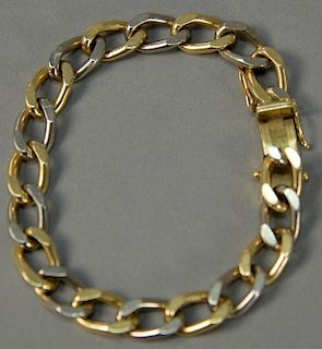 18K gold bracelet with alternating white gold and yellow gold links, marked J + A. 47.4 grams.