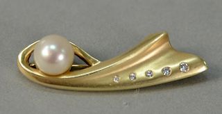 14K gold pin set with pearl and five small diamonds. 7.5 grams, lg. 1 3/4in.