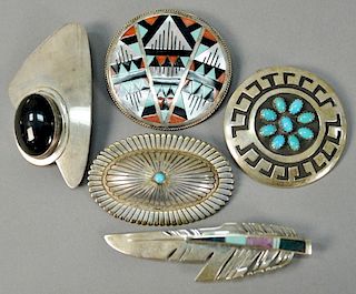 Five silver pins inlaid with stones, four signed including Leander and Lisa Othole, Rosco Scott, RR, and L Yazzie. longest 3 