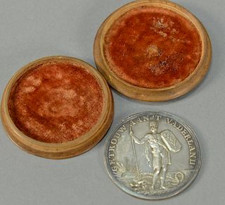 Silver medallion marked on back "AAN Deugd. En DapperHeid" front marked "Getrouw Aan't Vaderland" in original wood box. dia. 