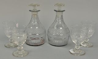 Six piece lot to include pair of crystal decanters and four stems all with petal style bases. decanter: ht. 9in., stems: ht. 