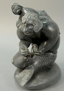 Inuit Eskimo carving, Sakariasie Napatuk (1928), Akulivik, Sedna with Child black soapstone on pedestal. ht. 12in., pedestal 