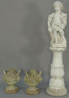 Three piece lot to include cement putti figure on cement pedestal, total ht. 61in. and pair of cement garden fruit baskets ht