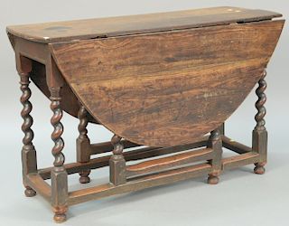 Oak gateleg drop leaf table, 18th century (new feet). ht. 29 1/2in., top closed: 17 1/2" x 46 1/2"