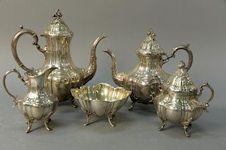Reed and Barton sterling silver tea and coffee service to include teapot, coffee pot, sugar bowl, creamer, and waste bowl. co