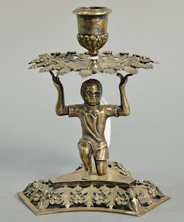 English silver candlestick with reticulated drop guard held by blackamoor kneeling figure on triangular reticulated base. ht.