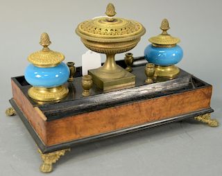 Wood desk set with two blue opaline inkwells plus center urn and four pen holders, all gilt bronze set on brass paw feet (ins