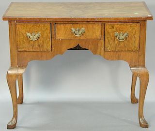 Burl mahogany veneered dressing table. ht. 28in., wd. 35 1/2in., dp. 19 1/2in.
