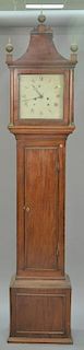 Mahogany tall clock with pediment top over square dial having brass works on plain case. ht. 92in. Provenance: Collection of 
