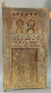 Primitive carved door and large steel head nail decoration, possibly several hundred years old, 29" x 52" plus hinges.