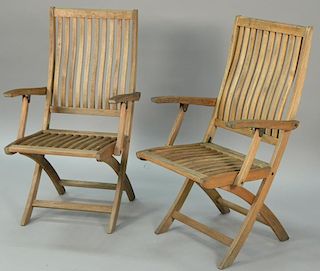 Set of eight Gloster teak folding armchairs.
