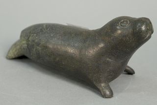 Inuit Eskimo carving Tudlik (1890-1960) Cape Dorset grey soapstone Seal, lg. 9in. Provenance: Waddington's Toronto, Canada lo