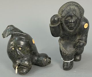 Two Inuit Eskimo figural carvings including Thomas Suvaaraq (1935) Baker Lake Inuit Woman (7" x 4" x 4 1/4") and dark grey ba