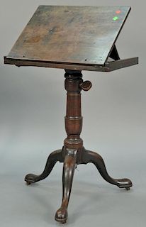George III mahogany book stand with adjustable top on pedestal with tripod base, early 19th century (small wood support missi
