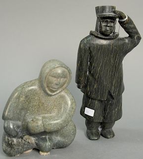 Two Inuit Eskimo figural carvings including Cape Dorset green serpentine Fisherman with Fish (ht. 9 1/2in.) and Samonie Toono