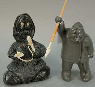 Two Inuit Eskimo figural carvings to include Wayne Puqiqnak Gjoa Haven black basalt-caribou sticks/leather rope Inuit Stretch