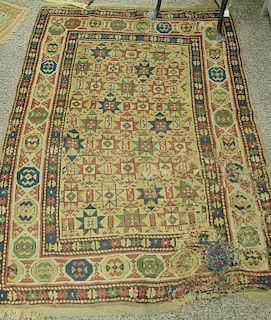 Caucasian Oriental throw rug, probably late 19th century (patched resewn). 4'2" x 5'11"