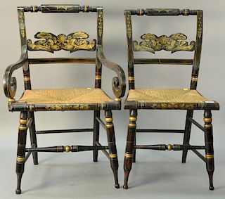 Set of eight Sheraton chairs, all stenciled with carved backs and rush seats includes two arm and six side. ht. 18in., seat h