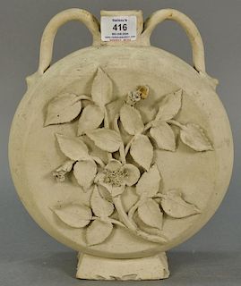 Stoneware moon flask with double handles and molded flowers and leaves by S.L. Pewters New Haven (base chips, flower chips). 
