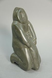 Inuit Eskimo carving Annie Niviaxie (1930-1989) Kuujjuarapik green soapstone Kneeling Figure with seal, 10 1/2".