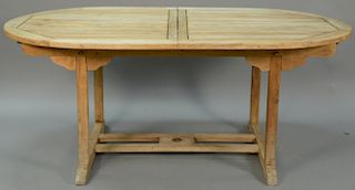 Plantation Timber teak extending table with built in leaf. ht. 29 1/2", closed 39" x 70", opens to 94in.