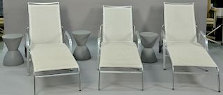 Six piece lot to include a set of three polished aluminum outdoor chaises along with three round stands.