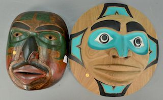 Two carved Eskimo Inuit masks including Rosewood Moon Spirit mask 15in. and Haida Eagle mask stained and painted 14 1/2" x 14