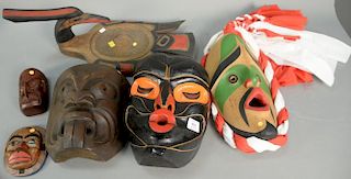 Six Eskimo Inuit carved figures and masks including moon mask by Arne George, Kwakiutz Hawk Mask by w. Waphams 2002, black pa