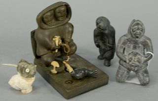 Four Inuit Eskimo figural carvings including David Ikutaaq (1929-1984) Baker Lake basalt Hunter (Provenance: Waddington's Fal