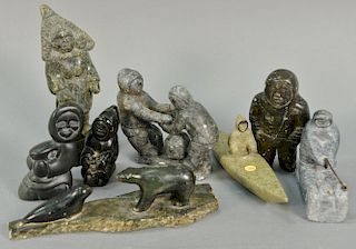 Eight Inuit Eskimo carved figures to include Inukjuak Man with Mukluk, serpentine Man, Inukjuak basalt Man on Sled, Youtie Su