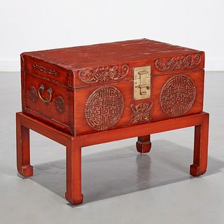 Chinese lacquered leather trunk on stand