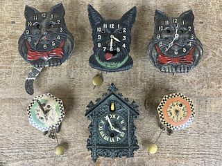 Six Miniature Wall Clocks