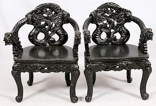 CHINESE CARVED EBONIZED WOOD ARM CHAIRS PAIR