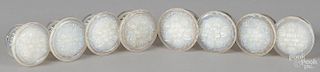 Eight New England clambroth glass furniture knobs.