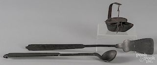 Wrought iron spatula and tasting ladle, 19th c., together with a fat lamp.