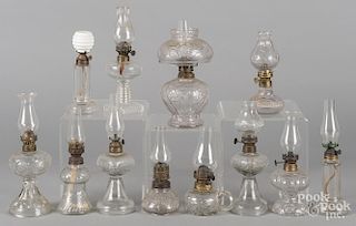 Collection of colorless glass fairy lamps.