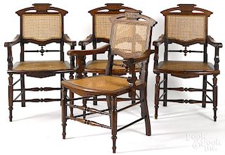 Four Victorian cane seat armchairs.