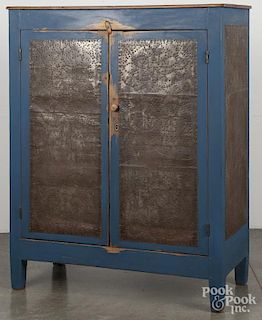 Painted pine pie safe, 19th c., retaining a later blue surface, the sides with profile portraits of
