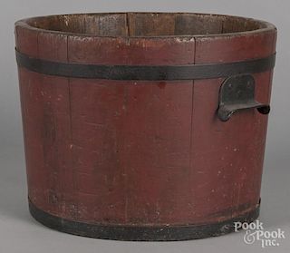 Painted pine bucket, 19th c., retaining an old red surface, 10 1/2'' h., 14'' w.