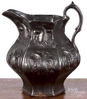 Molded pottery pitcher, 19th c., probably Woodbridge or Jersey City, New Jersey, with relief eagle d