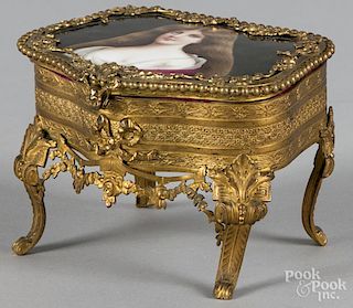 Gilt metal dresser box with painted porcelain inset top, 3 3/4'' h., 5 1/2'' w.