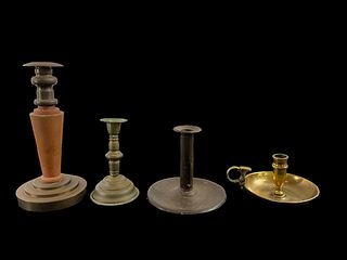A Grouping of 4 Different Styles Candlestick Holders