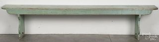 Painted pine mortised bench, 19th c., retaining an old light green surface, 19'' h., 93'' w.