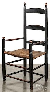 New England painted ladderback armchair, mid 18th c., retaining an old black surface.