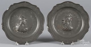 Pair of Continental etched and embossed pewter plates, 19th c., 9 5/8'' dia.