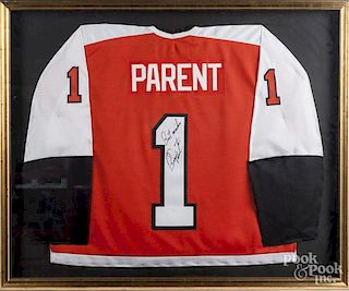 Framed Flyers jersey, signed by Bernie Parent.